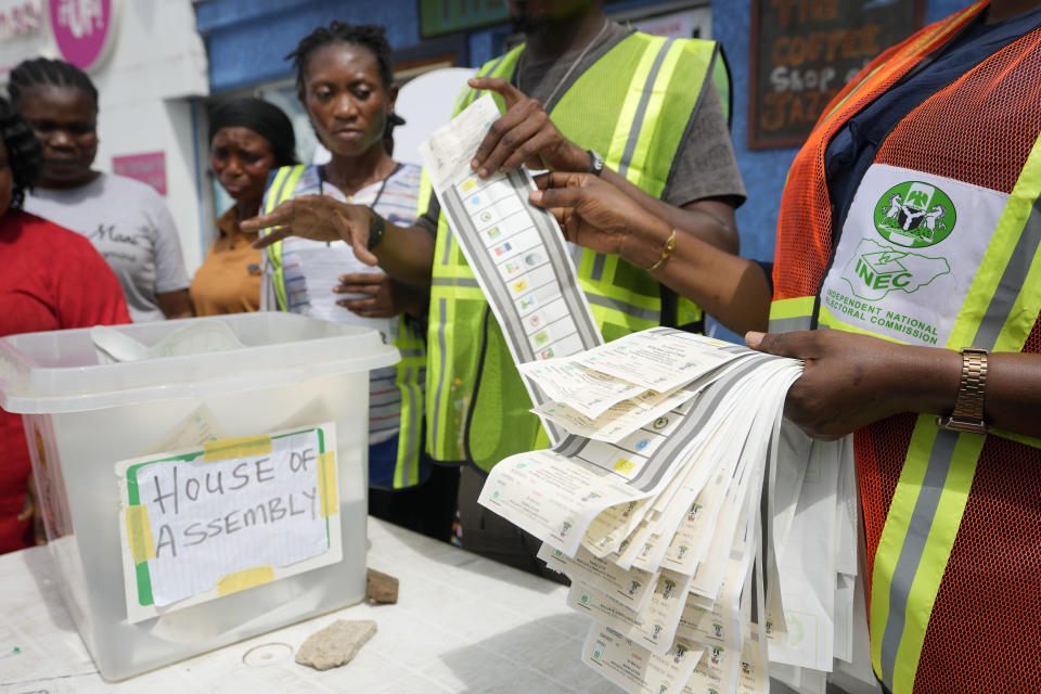 Electoral officials count ballots in front of party agents and observers at a polling station in Lagos, Nigeria, Saturday, March 18, 2023. Millions of Nigerians are headed back to the polls Saturday as Africa's most populous nation holds gubernatorial elections amid tensions after last month's disputed presidential vote. New governors are being chosen for 28 of Nigeria's 36 states as the opposition continues to reject the victory of President-elect Bola Tinubu from the West African nation's ruling party (AP Photo/Sunday Alamba)