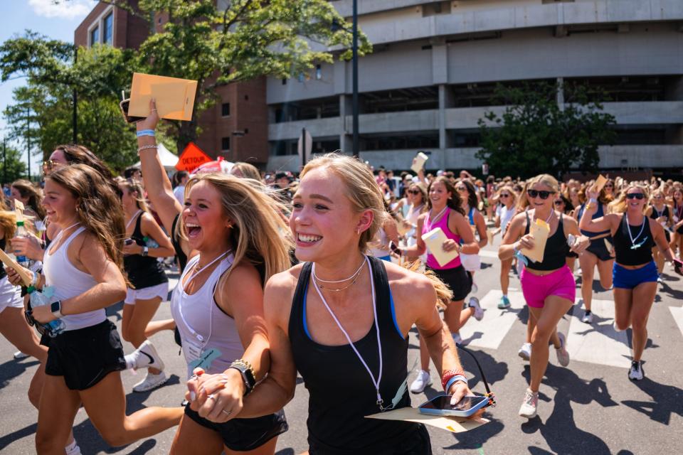 New members of Delta Delta Delta run out of Bryant Denny Stadium to meet their new sorority sisters on Bid Day at The University of Alabama. Sunday August 14, 2022. [Photo/Will McLelland] 