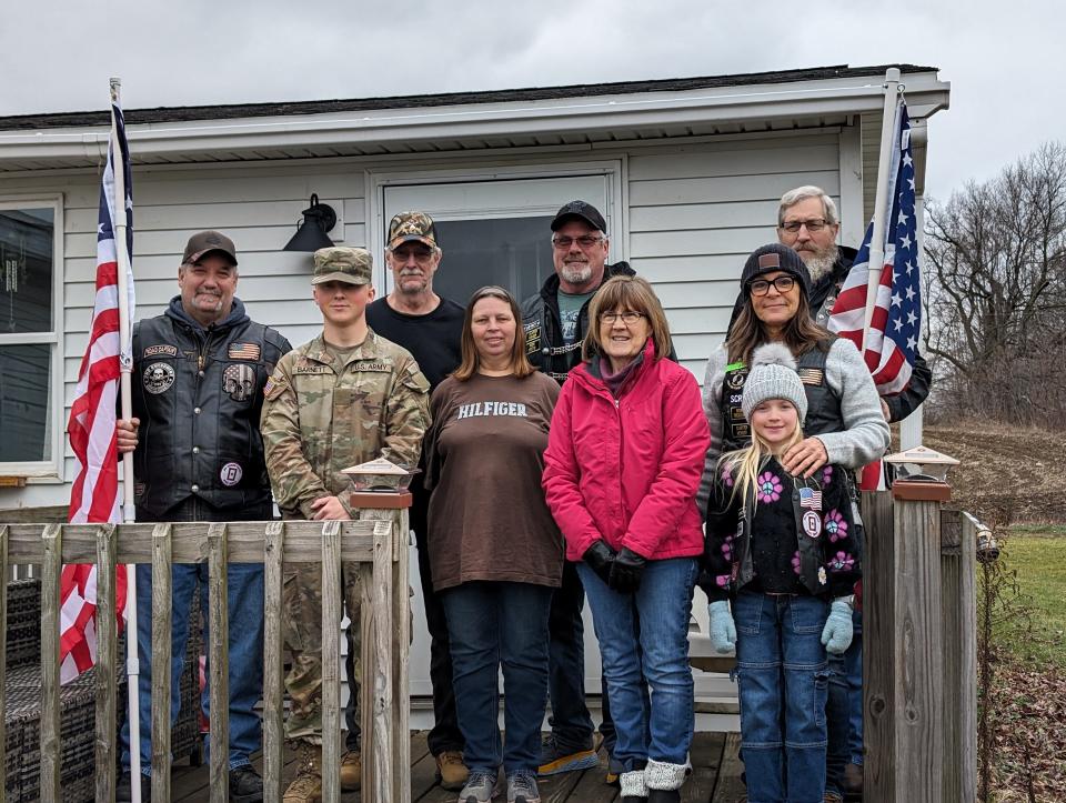 Private Bradley Barnett poses for a photo with his family and a few of Hillsdale's American Legion Riders.