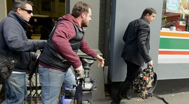 Terror menace Khodr Moustafa Taha clashes with news crews outside court. Photo: AAP