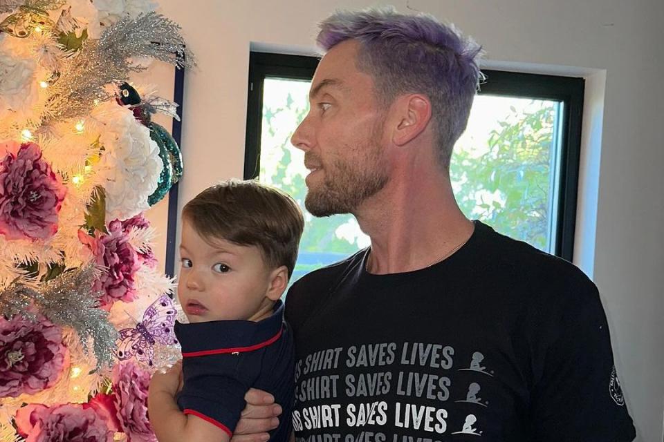 <p>Lance Bass/Instagram</p> Lance Bass and son Alexander decorate the tree