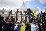 <p>Demonstrators hold black crosses with the names of those killed in weeks of violent demonstrations calling on Venezuela’s President Nicolas Maduro to step down, in St. Peter’s Square prior to the start of Pope Francis’ noon prayer, at the Vatican, May 7, 2017. (Andrew Medichini/AP) </p>