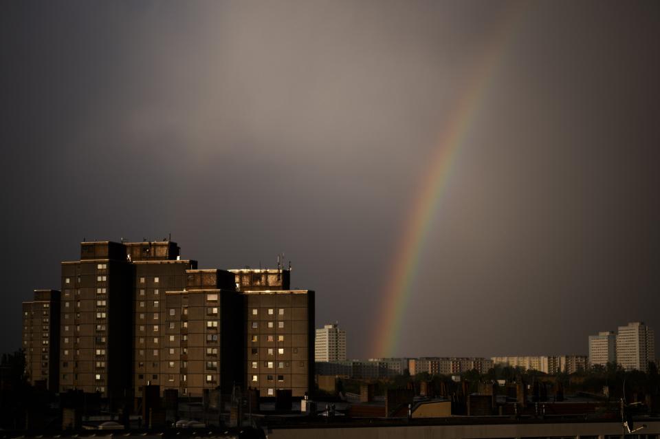 A rainbow appears in the sky over residents buildings in the German capital during a thunderstorm in Berlin, Tuesday, April 16, 2024. (AP Photo/Markus Schreiber)