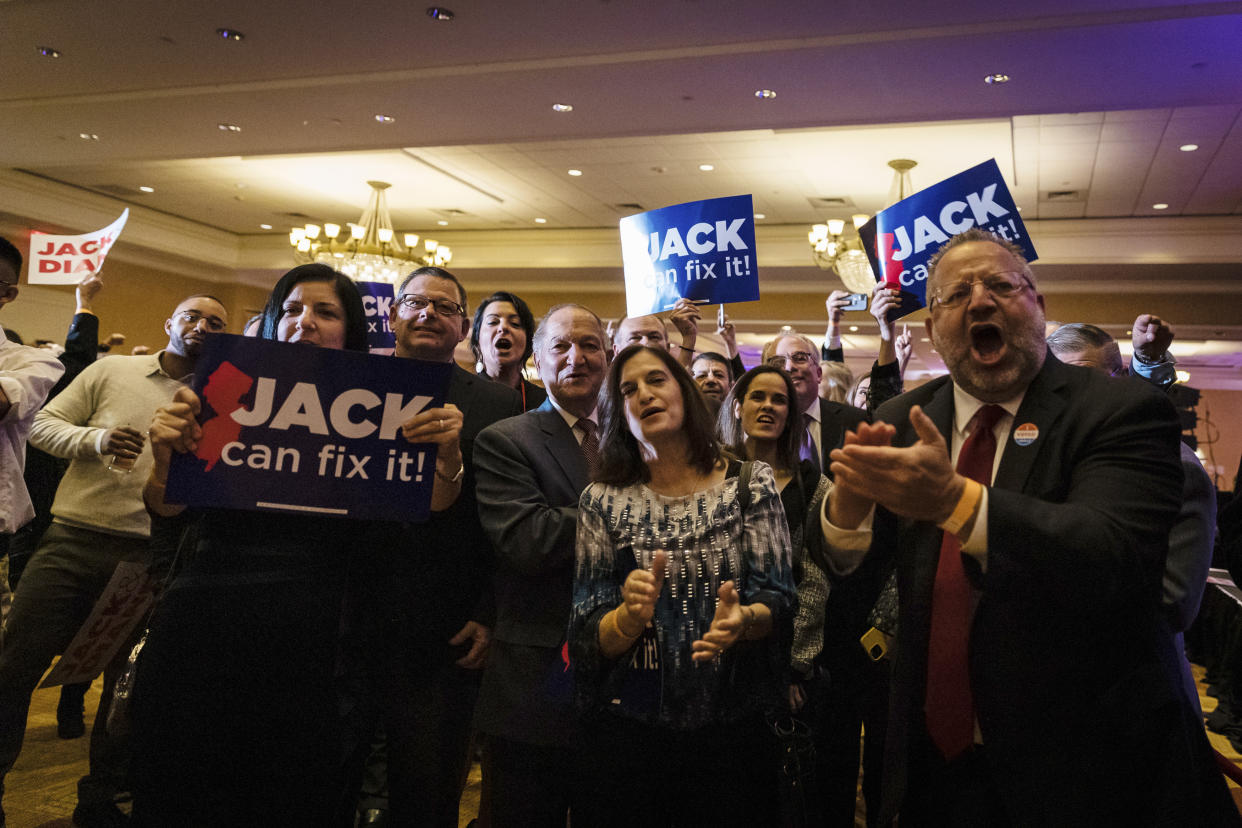 People cheering the incoming results at the election night party for Republican gubernatorial candidate Jack Ciattarelli, held at the Bridgewater Marriott hotel in Bridgewater, N.J., Tuesday, Nov. 2, 2021. (AP Photo/Stefan Jeremiah)