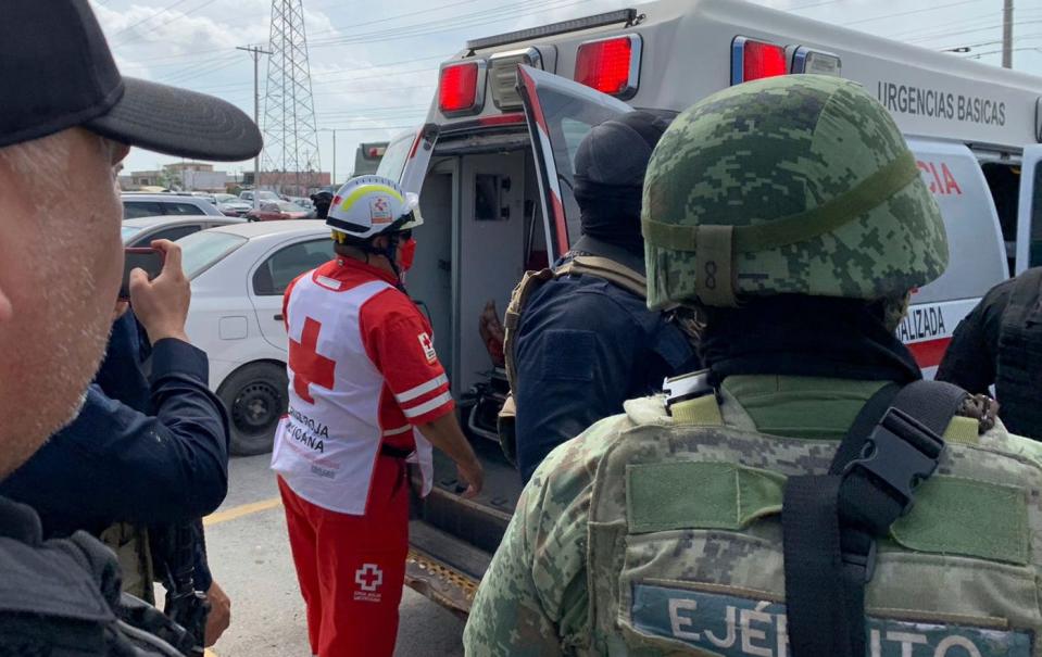 A Red Cross worker closes the door of an ambulance carrying two Americans found alive after their abduction in Mexico last week, in Matamoros, on March 7, 2023.