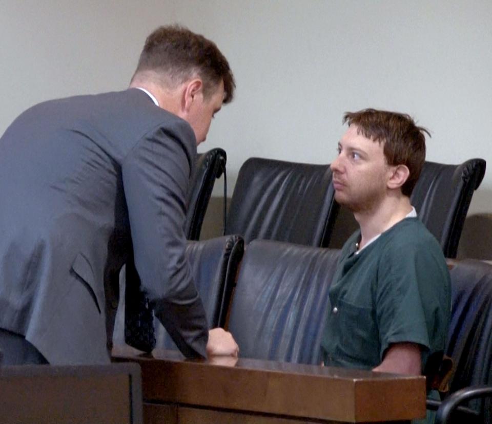 Kenneth H. Knapp Jr., listens to his attorney John Murphy during his sentencing for the aggravated manslaughter of his father, Kenneth Knapp Sr., and desecrating his remains. The sentencing was held before Judge Henry P. Butehorn at the Monmouth County Courthouse in Freehold Thursday, April 18, 2024.