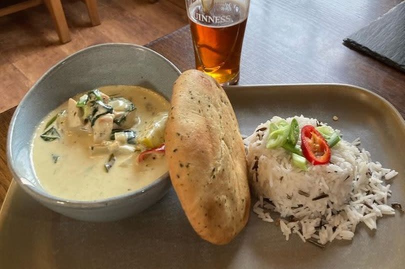 The Thai green curry was served with wild rice and naan bread