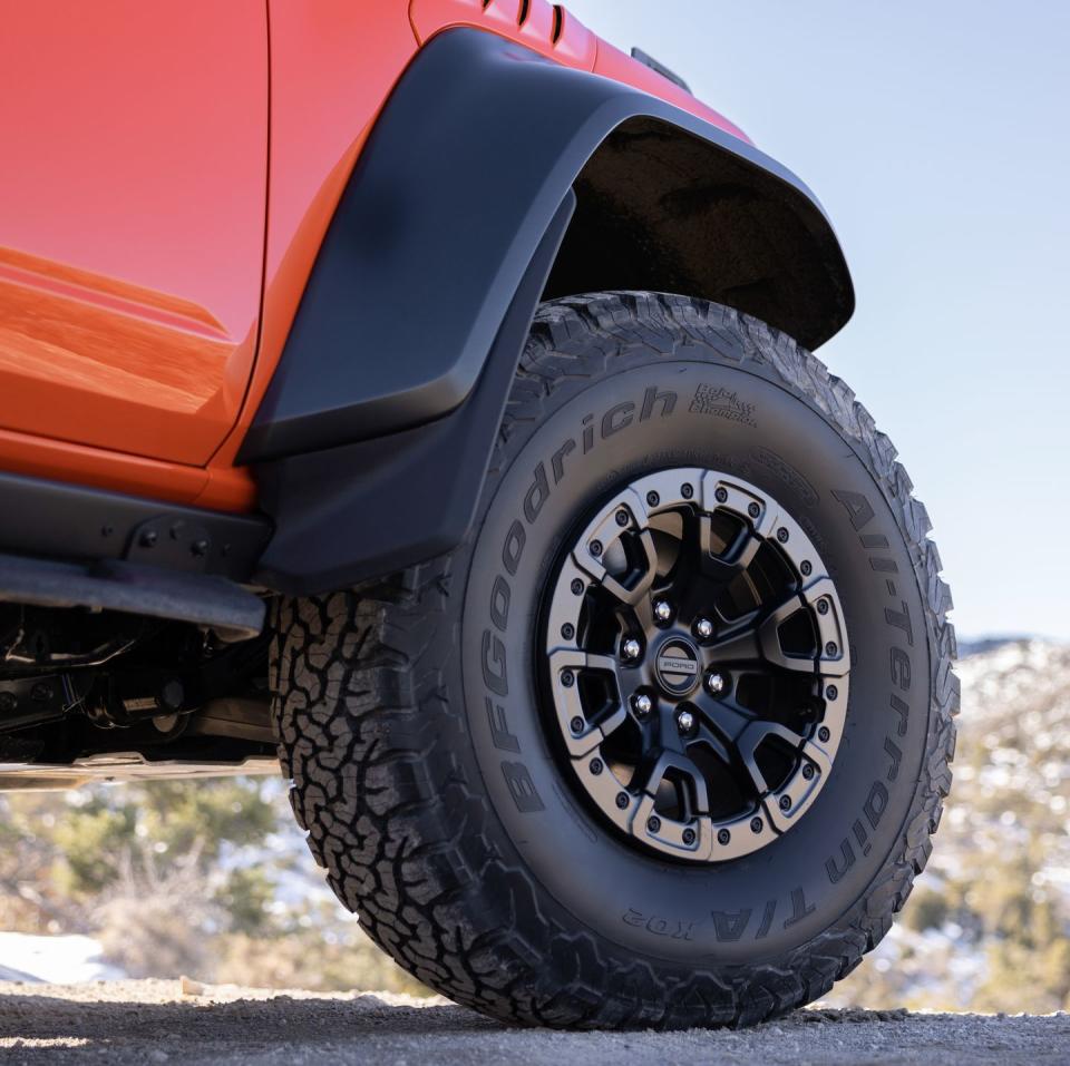 <p>Wheel travel needed to be increased to make room for the standard 37-inch BFGoodrich K02 all-terrain tires. They’re mounted on a set of standard 17-inch wheels, though two different styles of 17-inch beadlock-capable wheels are also available. The wheels are so heavy that Ford needed to reinforce the rear spare-tire carrier. </p>