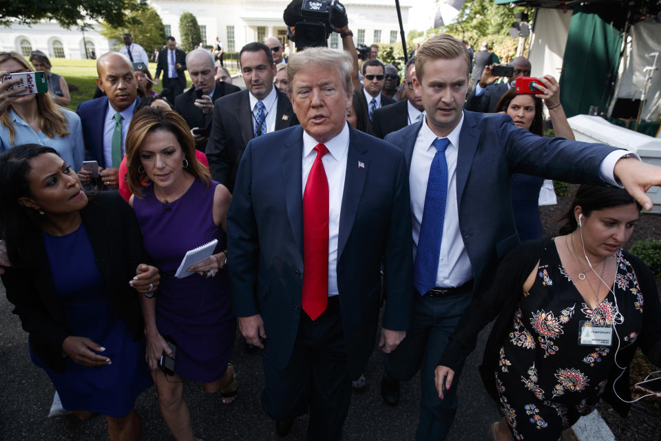 President Trump walks to an interview on the North Lawn of the White House on Friday. (Photo: Evan Vucci/AP)