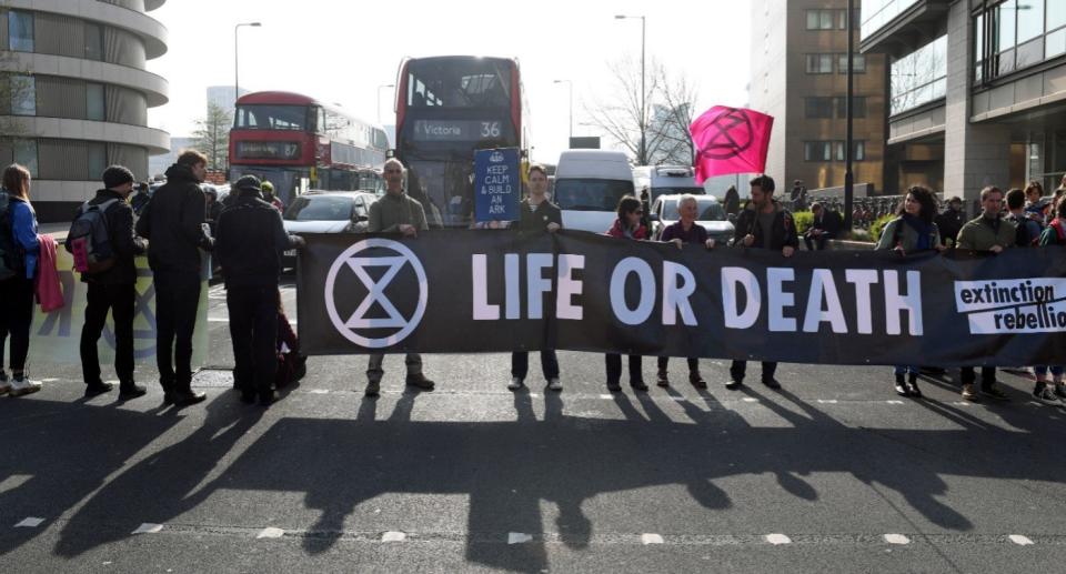 Extinction Rebellion demonstrators block Vauxhall Bridge in London, as more than 200 people have been arrested as police deal with ongoing climate change protests (PA)