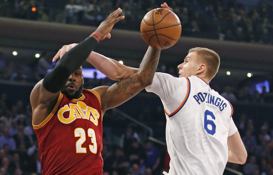 Kristaps Porzingis bonks LeBron James on the head. (AP)