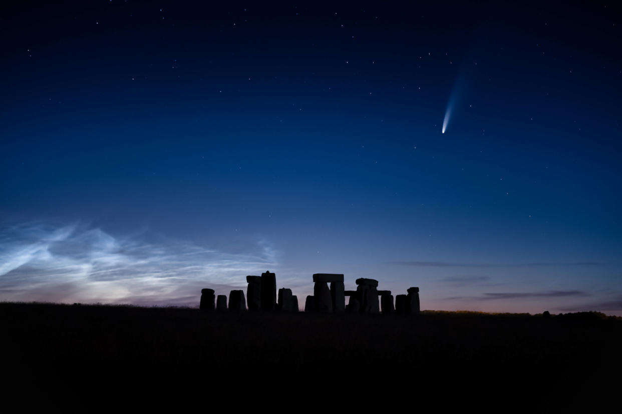 A blazing comet that has travelled for 6,800 years was seen streaking over Stonehenge on a perfect summers evening. See SWNS story SWBRcomet; Photographer Matthew Brown, 37, drove nearly three hours away from his home to get to the iconic neolithic stone monument to capture it during the clearest sky of the year.  On a spectacular evening, the rare Neowise comet could be seen as it came as close as 103 million km away from earth. The photographer managed to capture the breathtaking shot of the comet flying over the rocks late Friday night (July 10). The fireball shot through the sky on its once-in-a-6,800-year journey with the stunning Noctilucent clouds behind it. Noctilucent clouds, or night shining clouds, are A cloud-like phenomena in the upper atmosphere of Earth.   