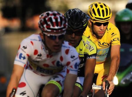 Astana team rider and Tour de France winner Vincenzo Nibali of Italy (R) cycles during the Tour de France Saitama Criterium race in Saitama, north of Tokyo October 25, 2014. REUTERS/Yuya Shino