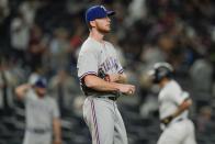 Texas Rangers starting pitcher A.J. Alexy, foreground, reacts as New York Yankees' Gary Sanchez runs the bases after hitting a home run during the second inning of a baseball game Monday, Sept. 20, 2021, in New York. (AP Photo/Frank Franklin II)