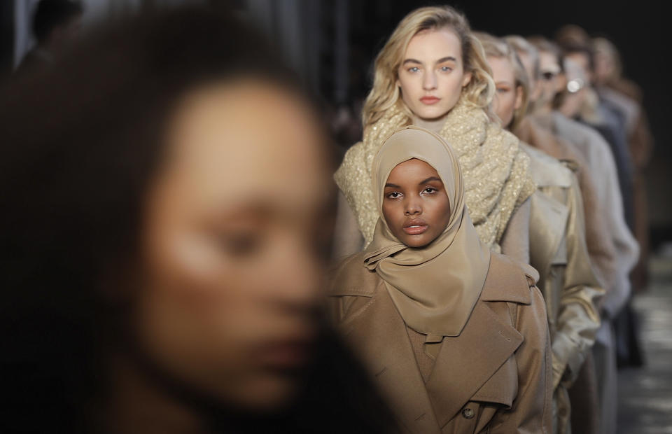 FILE - In this Feb. 23, 2017 file photo, Somali-American model Halima Aden wears a creation part of the Max Mara women's Fall-Winter 2017-18 collection, that was presented in Milan, Italy. Somali-American model Halima Aden has announced that she is taking a step back from the fashion industry, saying that the pandemic slowdown has given her time to see instances when her desire to maintain a hijab was not properly respected. (AP Photo/Luca Bruno).