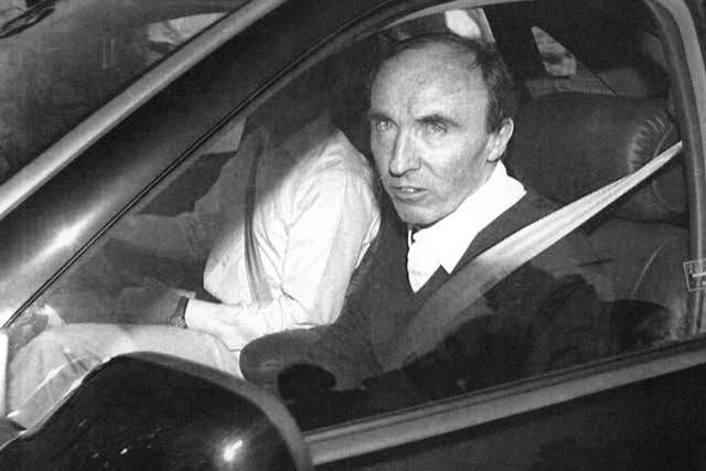 Williams F1 team boss Frank Williams in a car