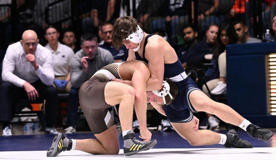 Penn State’s Tyler Kasak (right) battles Lehigh’s Drew Munch (149 lbs.) during Sunday’s match at Rec Hall at Penn State. Kasak edged Munch, 7-5. Penn State defeated Lehigh, 30-10.