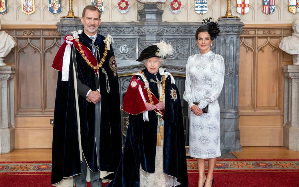 Queen Elizabeth II (centre) with King Felipe VI of Spain and his wife, Queen Letizia, in St George's Hall, at Windsor Castle, after the king was invested as a Supernumerary Knight of the Garter, ahead of the Order of the Garter Service at St George's Chapel in 2019 - Steve Parsons 