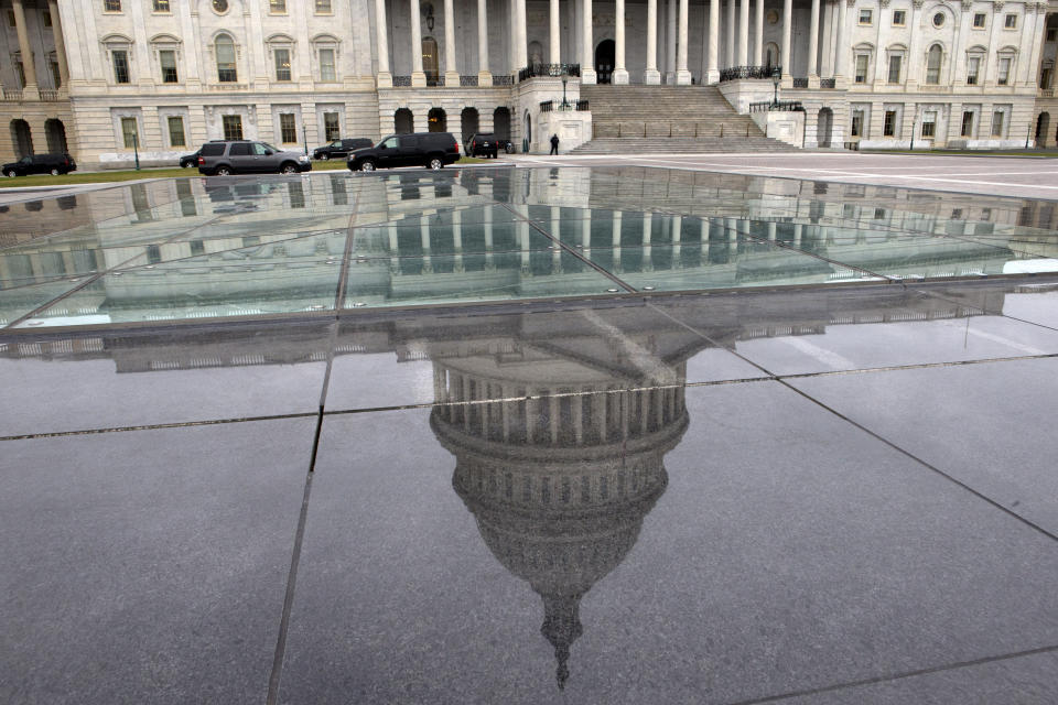 The dome of the Capitol is reflected in a skylight of the Capitol Visitor's Center in Washington, Tuesday, Jan. 1, 2013. (AP Photo/Jacquelyn Martin)