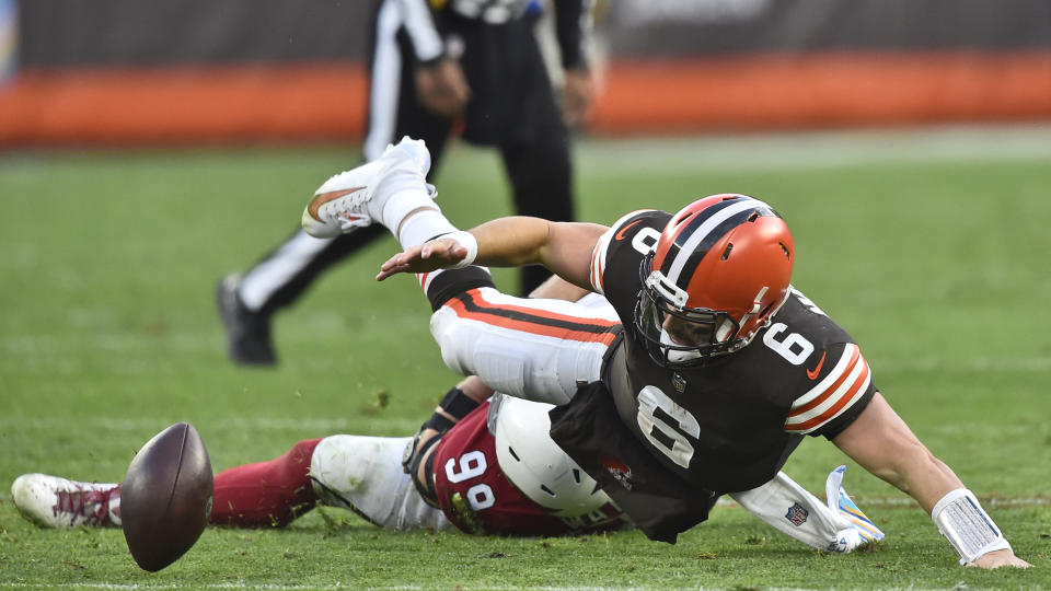 Cleveland Browns quarterback Baker Mayfield (6) fumbles and is injured on a play during the second half of an NFL football game against the Arizona Cardinals, Sunday, Oct. 17, 2021, in Cleveland. (AP Photo/David Richard)
