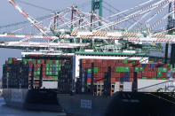 Cargo containers sit stacked on ships at the Port of Los Angeles, Wednesday, Oct. 20, 2021 in San Pedro, Calif. California Gov. Gavin Newsom on Wednesday issued an order that aims to ease bottlenecks at the ports of Los Angeles and Long Beach that have spilled over into neighborhoods where cargo trucks are clogging residential streets. (AP Photo/Ringo H.W. Chiu)