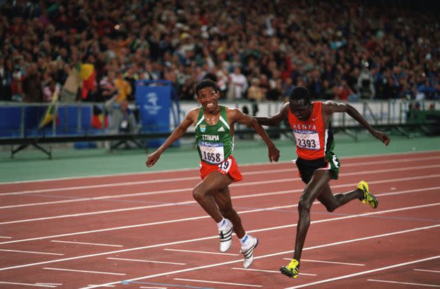 Haile Gebrselassie from Ethiopia and Paul Tergat from Kenya at the finish line of the men's 10,000-meters of the 2000 Olympics. Gebrselassie (L) won gold.   (Photo by Dimitri Iundt/Corbis/VCG via Getty Images) (Photo: Dimitri Iundt via Getty Images)
