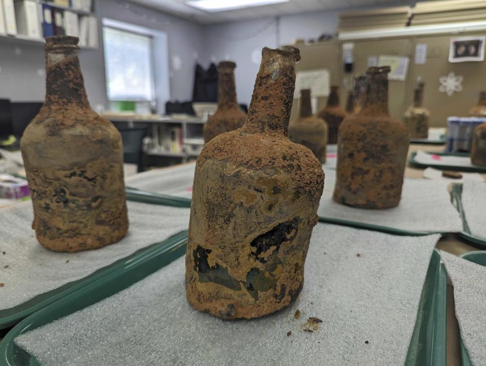 18th century artifacts found underneath George Washington's residence in Mount Vernon, Va., Monday, June 17, 2024. Earlier this year, a few dozen 18th-century glass bottles containing fruit were unearthed in the mansion cellar of the America's first president. (AP Photo/Nathan Ellgren)