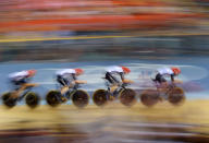 The Great Britain team ride during their Mens Team Pursuit qualifying race at the Olympic Games in London, Thursday, Aug. 2, 2012. (AAP Image/Dave Hunt) NO ARCHIVING