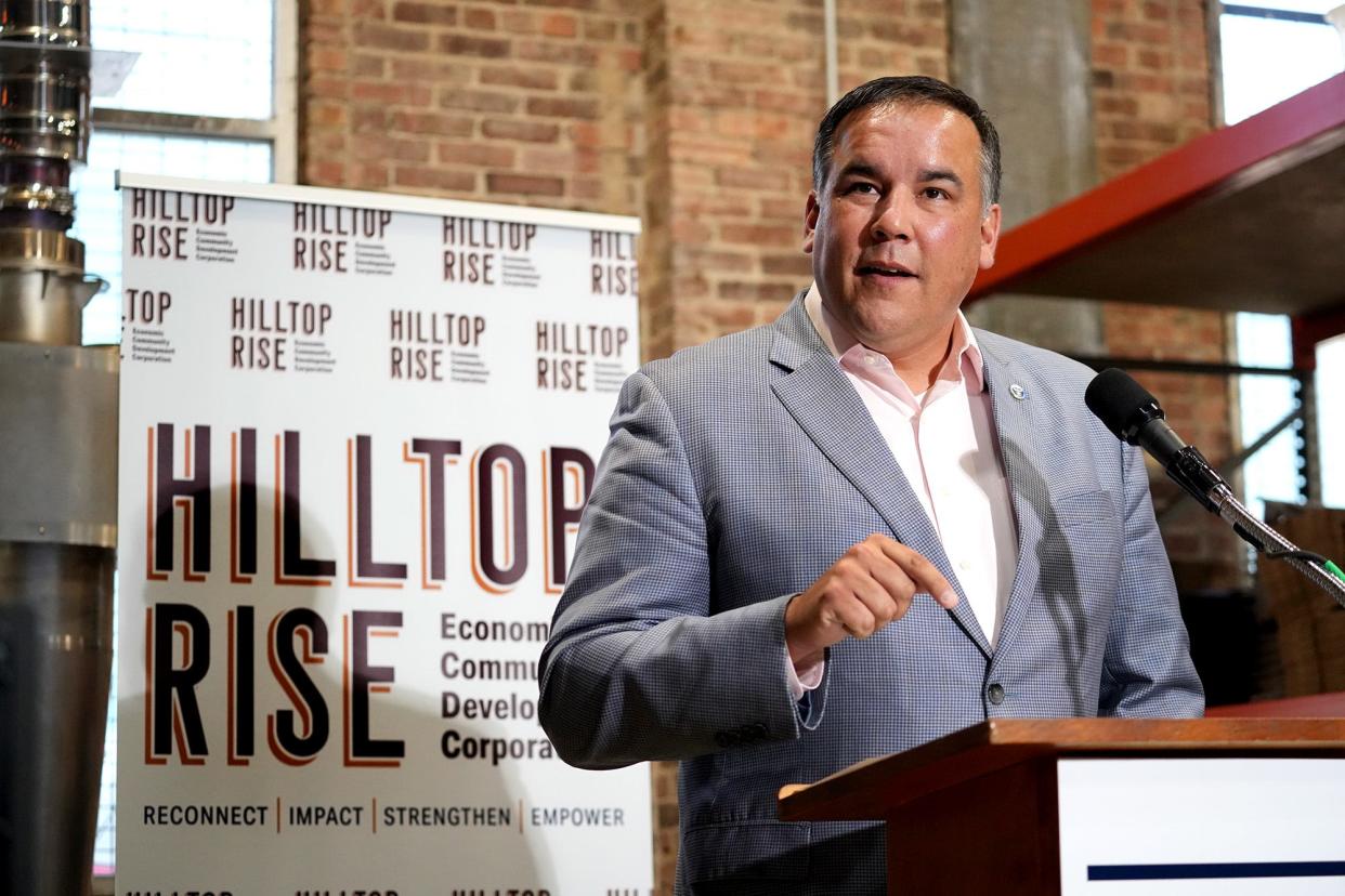 July 14, 2022; Columbus, Ohio; Community leaders spoke about efforts to revive the Hilltop through Hilltop RISE Economic Community Development Corporation, a new entity. The press conference was held at Roosevelt Coffee Roasters which is located in a historic bank building on the Hilltop.  Columbus mayor Andrew J. Ginther speaks at the press conference. Fred Squillante-The Columbus Dispatch