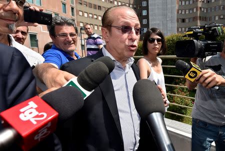 Paolo Berlusconi, brother of Silvio, speaks with journalists outside the San Raffaele Hospital, as Italian surgeons began a four-hour heart surgery on the former Prime Minister Silvio Berlusconi on Tuesday to replace a defective aortic valve, a hospital statement said, in Milan, Italy June 14, 2016. REUTERS/Flavio Lo Scalzo