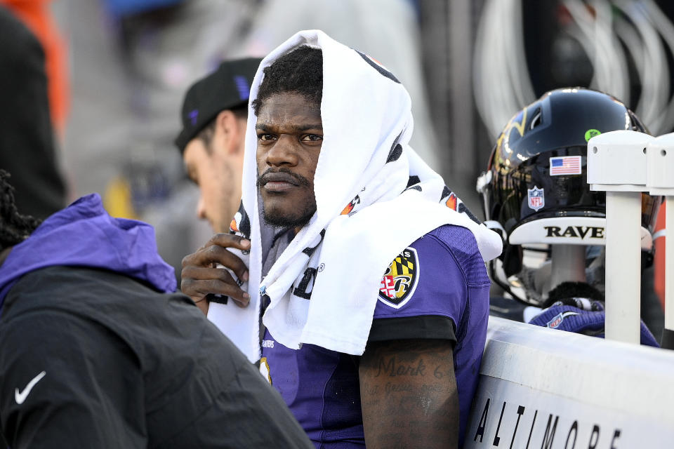 Baltimore Ravens quarterback Lamar Jackson sits on the bench during the second half of an NFL football game against the Cincinnati Bengals, Sunday, Oct. 24, 2021, in Baltimore. The Bengals won 41-17. (AP Photo/Nick Wass)