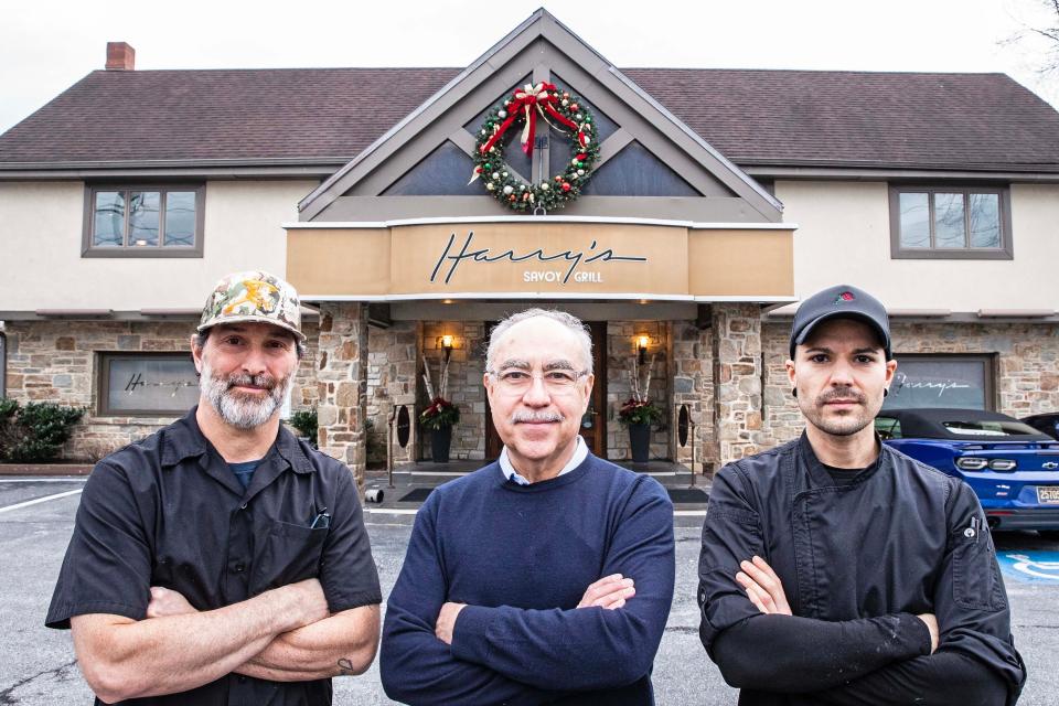 From left, Steve Forte, culinary director, Xavier Teixido, owner, and Tony Warder, chef de cuisine, stand in front of Harry's Savoy Grill, in Wilmington, Tuesday, Dec. 19, 2023. Harry's Savoy Grill was named one of USA Today Restaurants of the Year 2024.