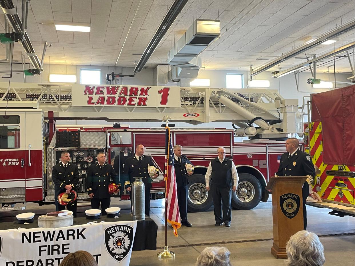 Newark Fire Chief Brandon Metzger (right) addresses newly promoted Newark Deputy Fire Chief Doug Vermaaten, Assistant Chief Allen Ashcraft, Capt. Todd Smith, and Lt. Brandon Turner (from right to left) while Newark Mayor Jeff Hall looks on during a promotion ceremony at Newark Fire Station 1 on Tuesday, Nov. 22, 2022.