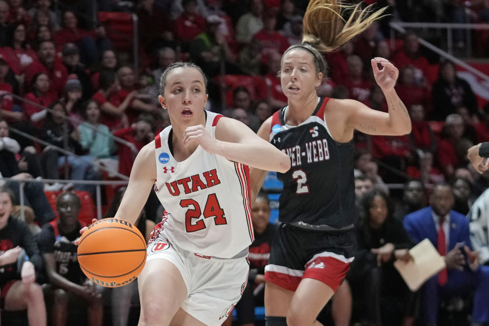 Utah guard Kennady McQueen (24) drives as Gardner-Webb guard Lauren Bevis (2) defends during the first half of a first-round college basketball game in the women's NCAA Tournament, Friday, March 17, 2023, in Salt Lake City. (AP Photo/Rick Bowmer)