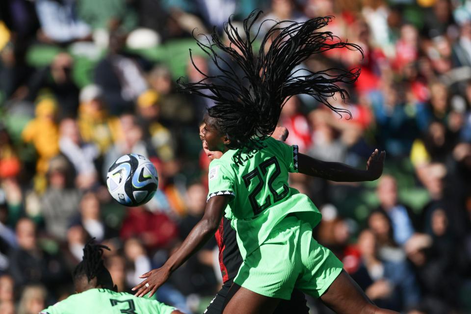 Nigeria's Michelle Alozie heads the ball during a Group B match against Canada in the 2023 World Cup.