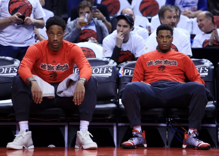 DeMar DeRozan and Kyle Lowry zone out. (Vaughn Ridley/ Getty Images)