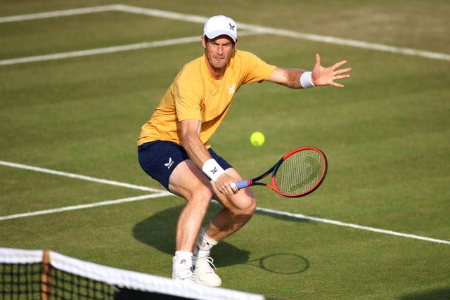 Andy Murray plays a backhand volley