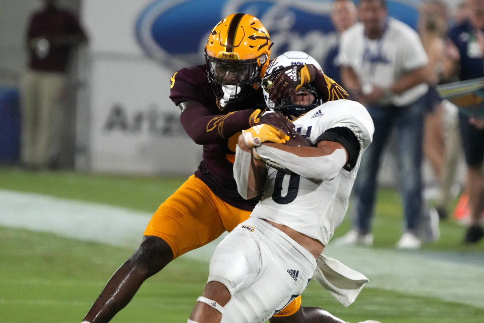 Arizona State defensive back Ro Torrence tackles Northern Arizona wide receiver Coleman Owen (6) during the first half of an NCAA college football game Thursday, Sept. 1, 2022, in Tempe, Ariz. (AP Photo/Rick Scuteri)