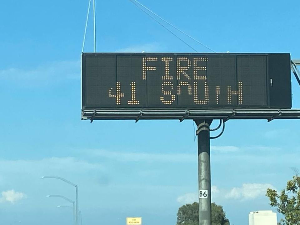 A highway sign warns drivers of a fire on Highway 41 in Fresno, California, on Monday, July 24, 2023.