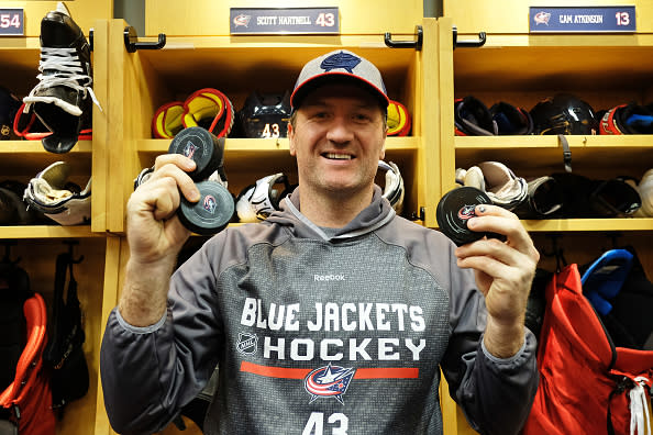 COLUMBUS, OH - DECEMBER 22: Scott Hartnell #43 of the Columbus Blue Jackets poses with his three pucks after scoring a hat trick during a game against the Pittsburgh Penguins on December 22, 2016 at Nationwide Arena in Columbus, Ohio. Columbus defeated Pittsburgh 7-1. (Photo by Jamie Sabau/NHLI via Getty Images)