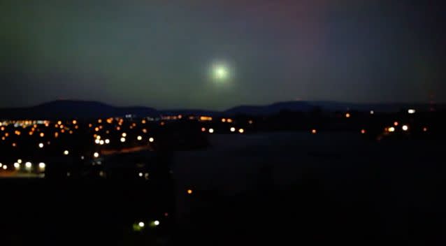 The original video shows a green ball of light exploding over Canberra. Photo: Screenshot