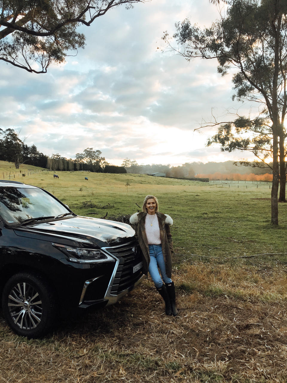 Kate Waterhouse leaning against a Lexus LX four-wheel-drive in the Southern HIghlands