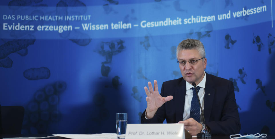 The head of the Robert Koch Institute, Germany's federal government agency and research institute responsible for disease control and prevention, Lothar Wieler, addresses a news conference on the coronavirus and the COVID-19 disease in Berlin, Thursday, Oct. 22, 2020. Germany's disease control center is reporting a new daily record increase in coronavirus infections, which rocketed past the 10,000 mark for the first time as the pandemic continues to spread. Slogan in background reads: ' Generating evidence sharing knowledge protecting and improving health'. (AP Photo/Markus Schreiber, Pool)