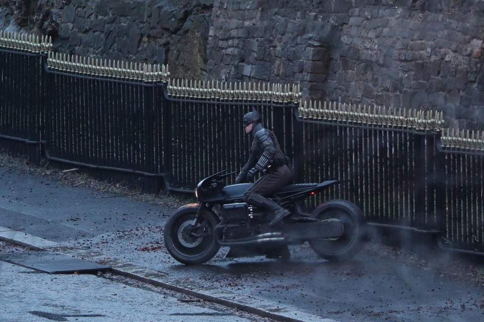 A man dressed as Batman sits on a motorcycle as filming continues in Glasgow for a new movie for the Batman superhero franchise. (Photo by Andrew Milligan/PA Images via Getty Images)