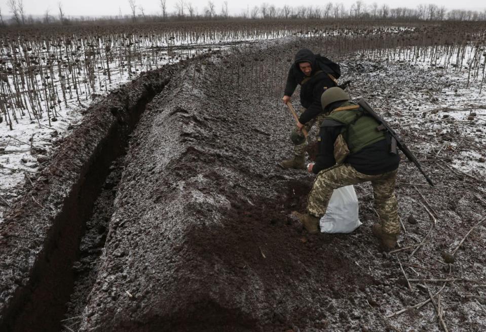 <div class="inline-image__caption"><p>Ukrainian soldiers equip trenches on a field not far from Soledar on Jan. 14.</p></div> <div class="inline-image__credit">Anatolii Stepanov/AFP via Getty</div>