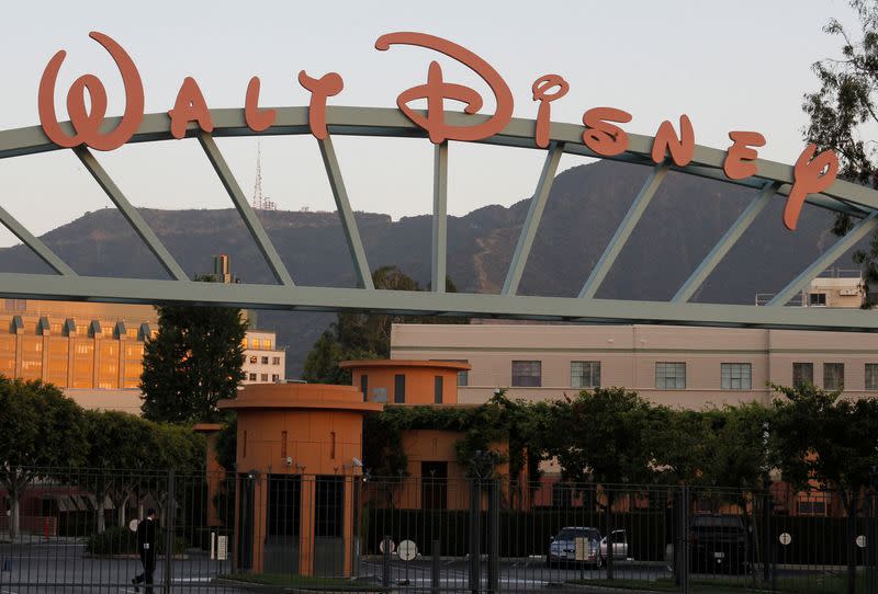 FILE PHOTO: A portion of the signage at the main gate of The Walt Disney Co. is pictured in Burbank, California