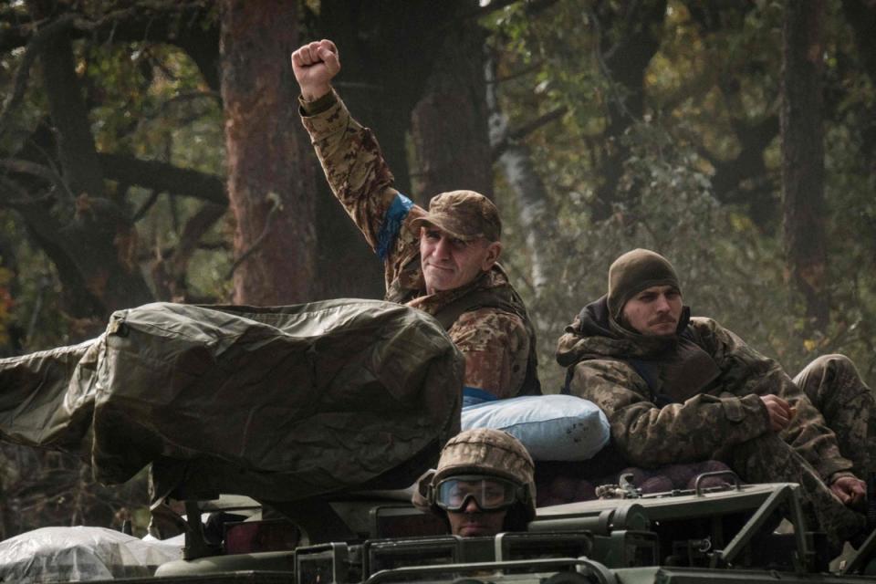 A Ukrainian soldier on an armoured vehicle near the recently liberated town of Lyman in Donetsk on Thursday (AFP/Getty)