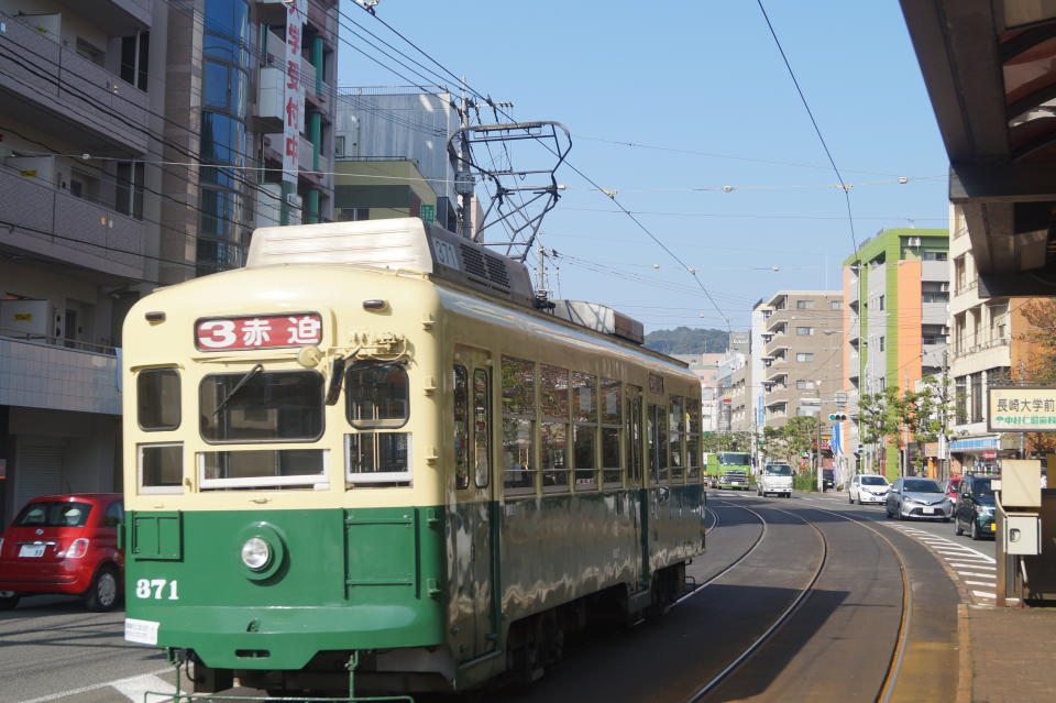 <p>Commuters travel to work using the Nagasaki Electric Tramway. (Photo: Michael Walsh/Yahoo News) </p>