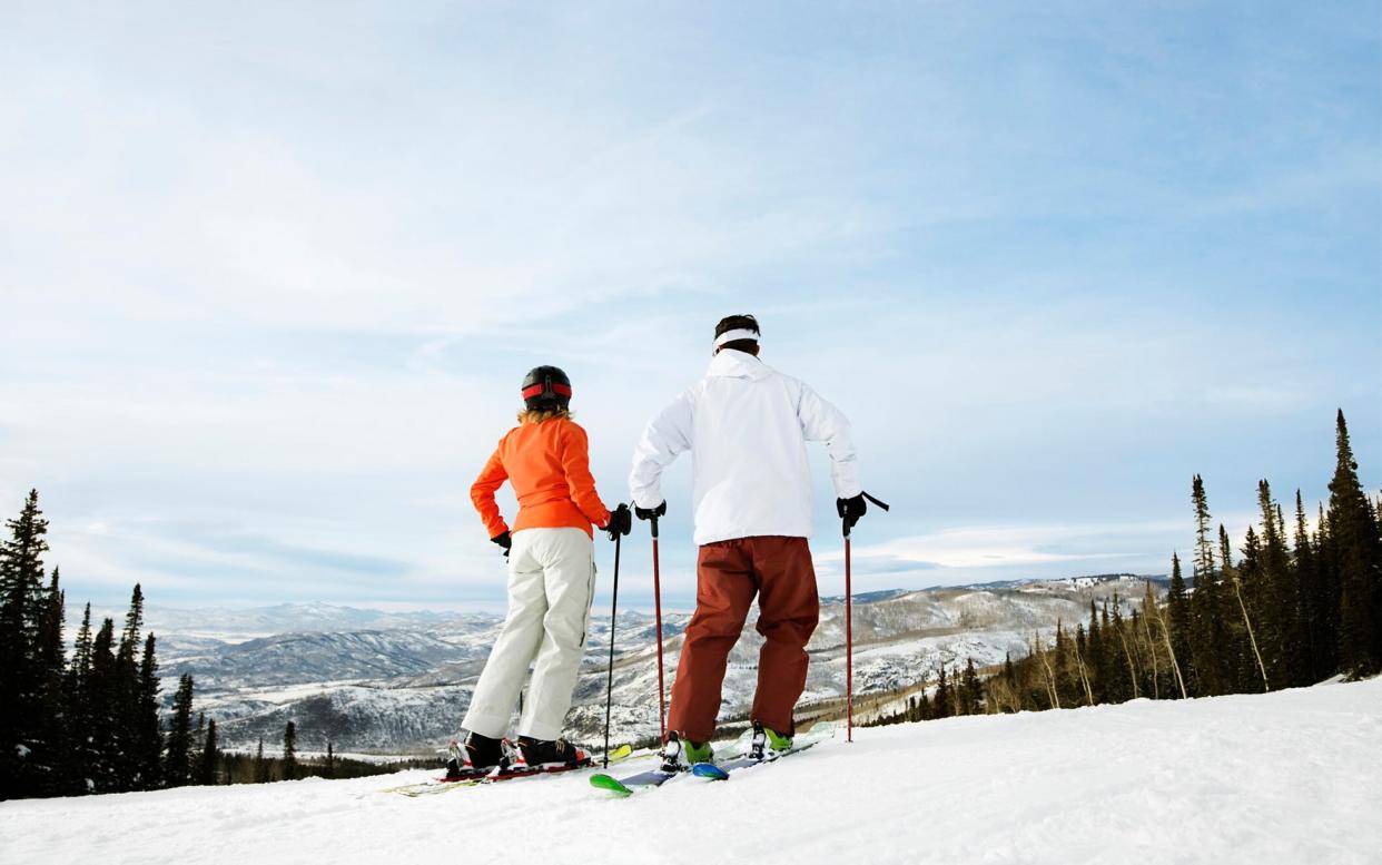 skiers on mountain - getty