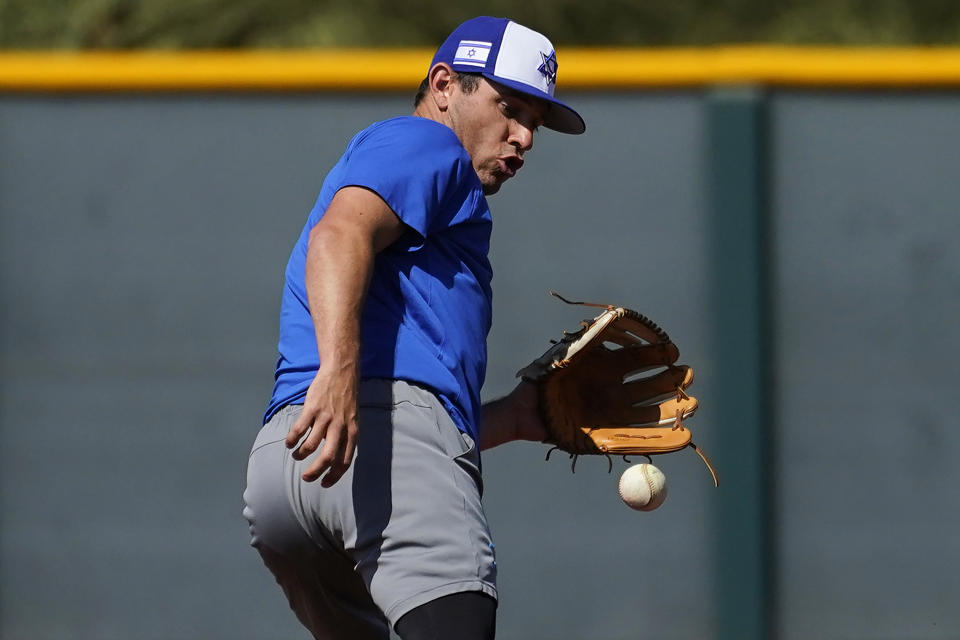 Israel Olympic baseball player Ian Kinsler takes fielding practice at Salt River Fields spring training facility, Wednesday, May 12, 2021, in Scottsdale, Ariz. Israel has qualified for the six-team baseball tournament at the Tokyo Olympic games which will be its first appearance at the Olympics in any team sport since 1976. (AP Photo/Matt York)